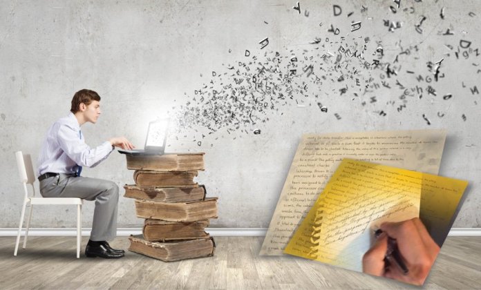 Typist composing text in laptop