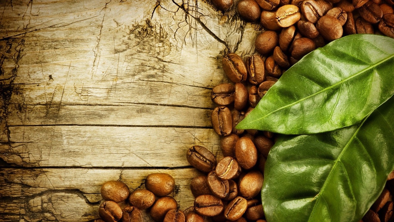 Person drinking a hot drink at the computer