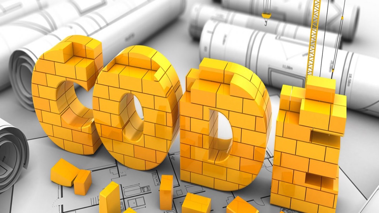 Someone wearing a hardhat and carrying code