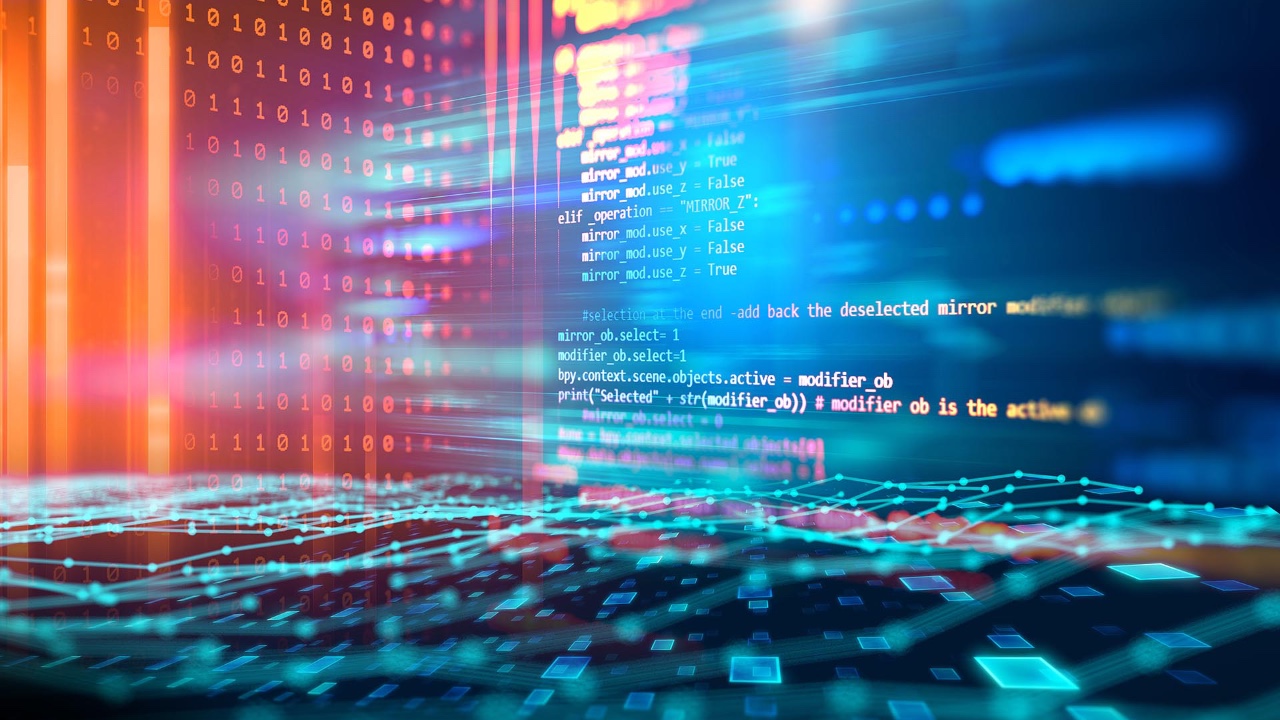 Person programming on a laptop on a building